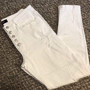 Distressed white denim skinny jeans